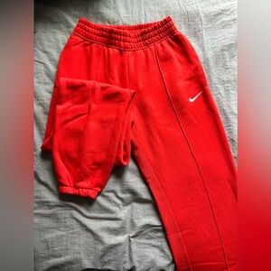Red Nike basketball sweatpants